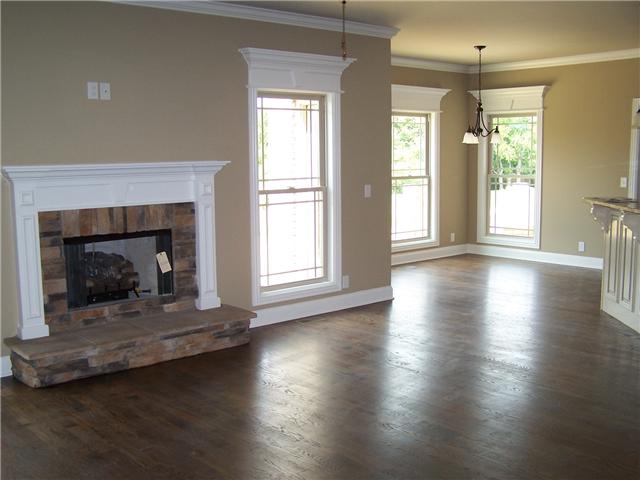 Main living room with lots of light and a lovely fireplace